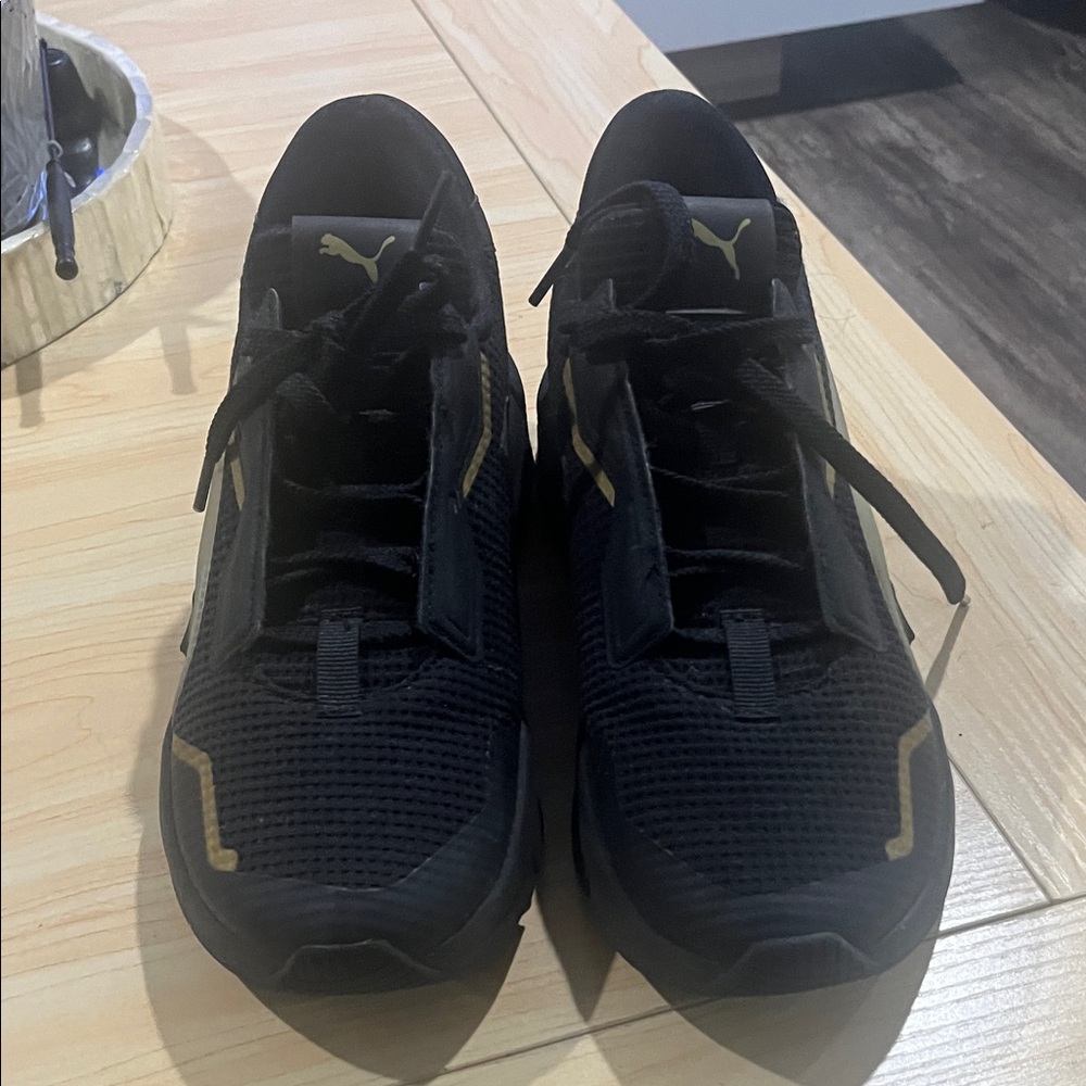 Puma Black Sneakers with Gold Highlights